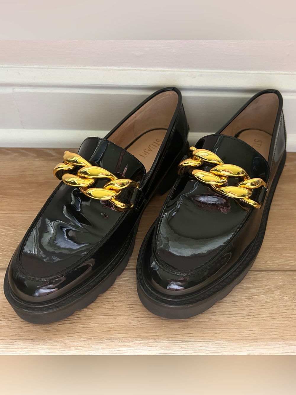 Stuart Weitzman Black Patent Leather Loafers with Gold Chain Accent